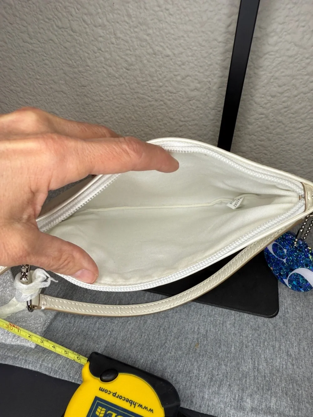 Coach Shimmering Ivory Leather Large Wristlet Clutch with Blue Glitter Charm